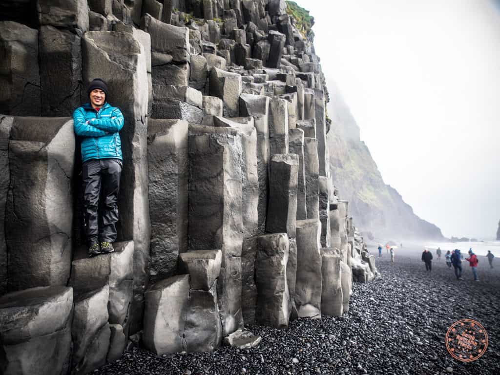 standing in a basalt column in reynisdrangar iceland