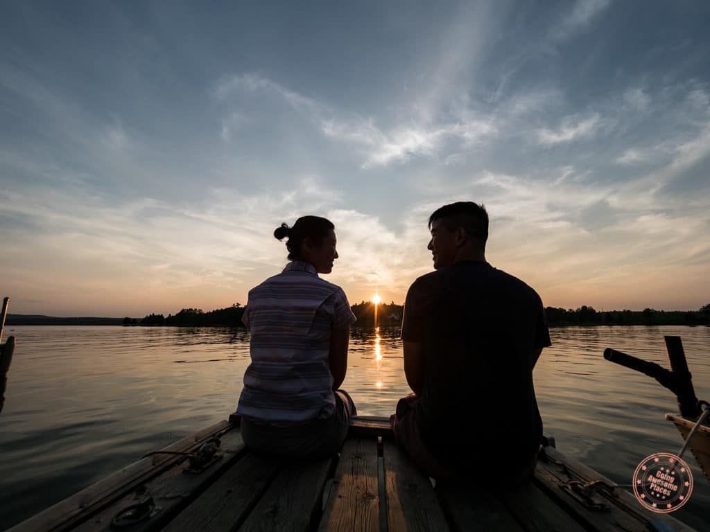 couple watch perfect sunset at calabogie lake