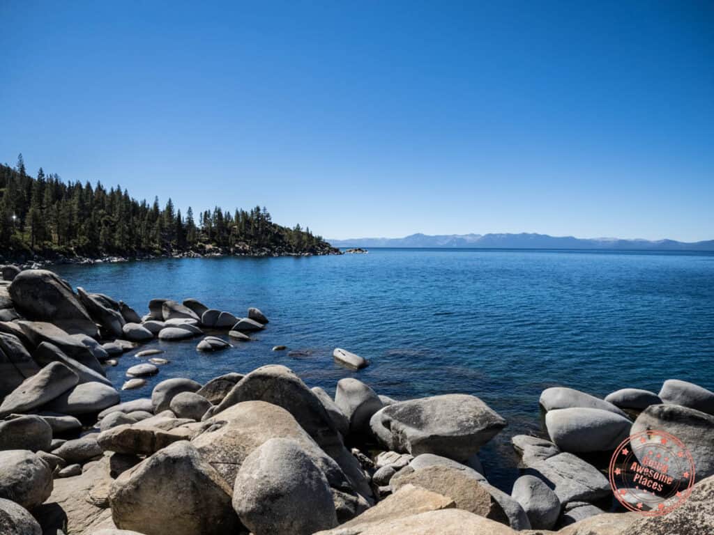 Lake Tahoe coast line with evergreens and blue water on a Weekend trip from San Francisco