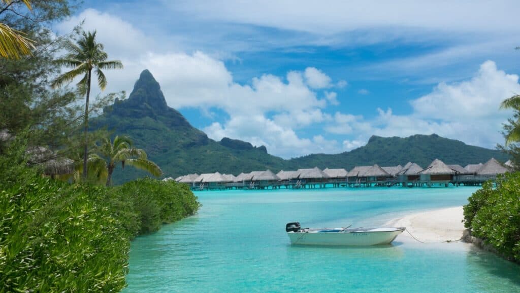 boat outside InterContinental Bora Bora Resort villas