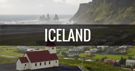 destination iceland with church town and coastline in the background