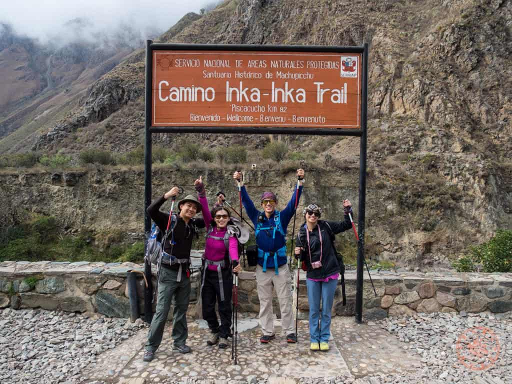inca trail entrance group photo with friends