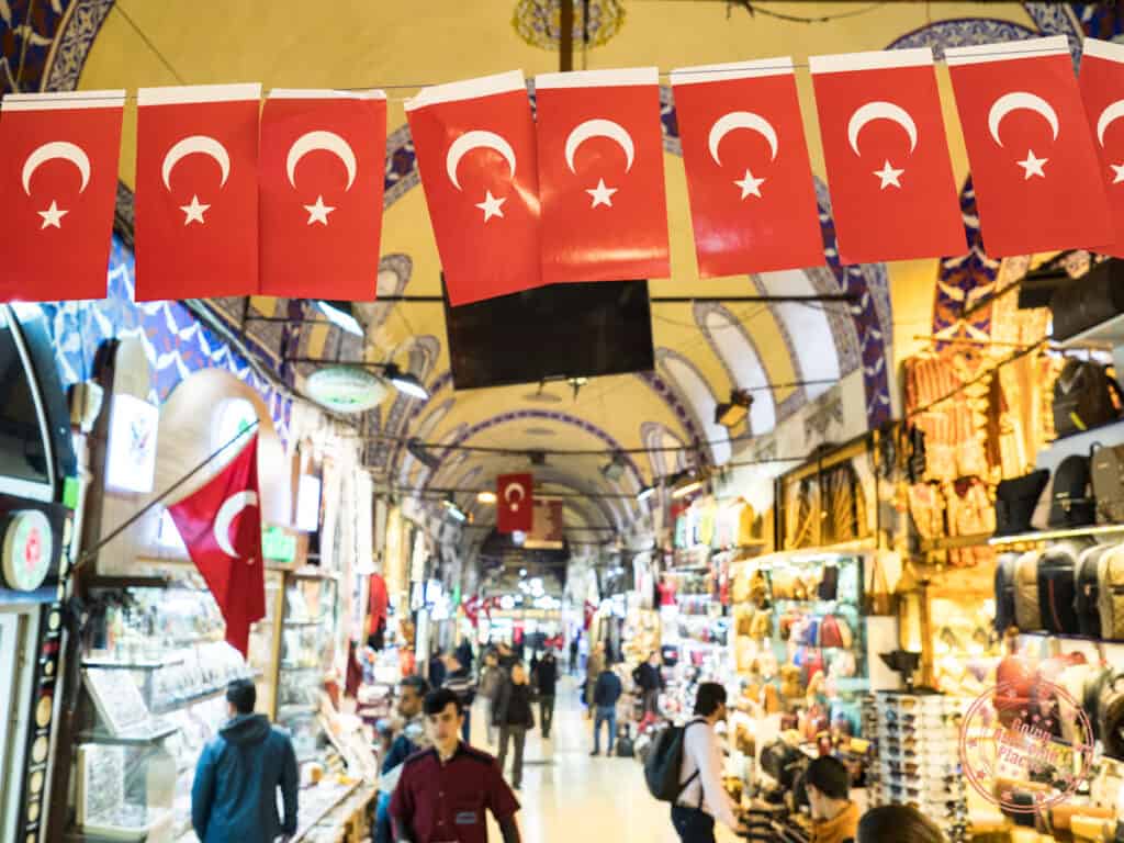 grand bazaar with a row of small flags of turkey in focus