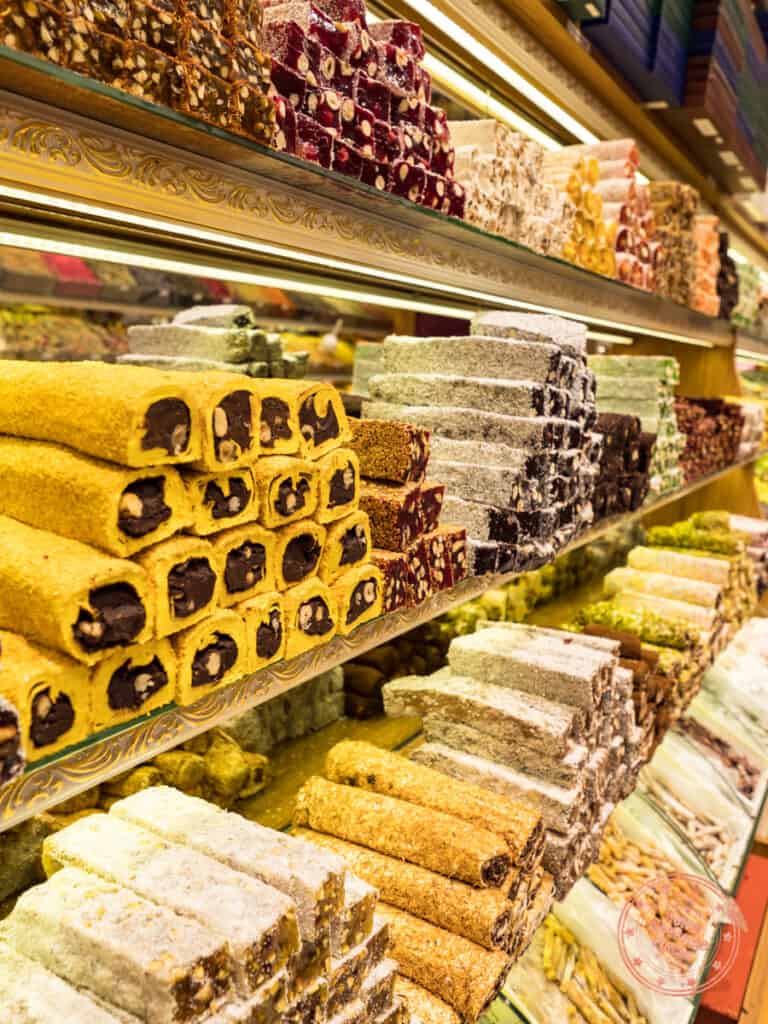 colourful stacks and shelves of turkish delight inside the grand bazaar