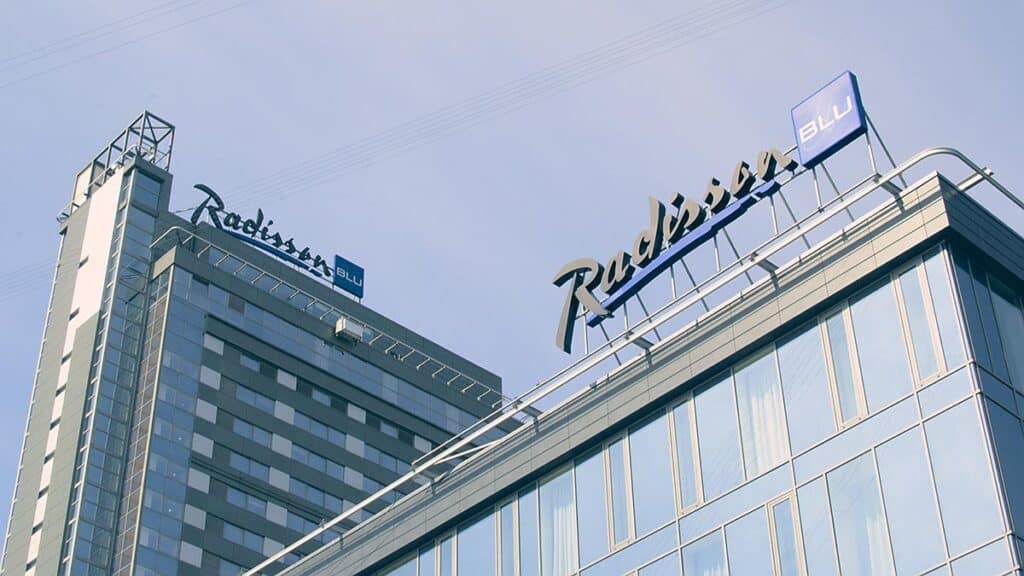 radisson corporate codes with radisson blu hotel sign