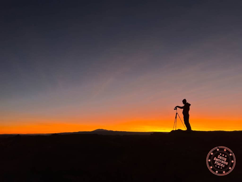 silhouette of photographer taking sunset photos in atacama desert