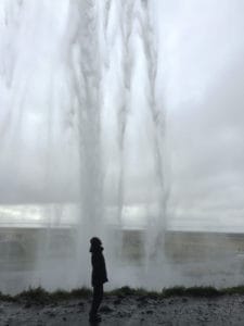 Standing underneath Seljalandsfoss in Iceland