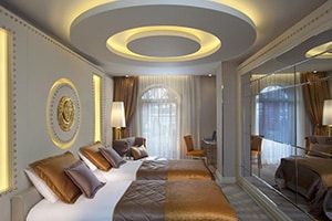 sura design hotel and suites opulent bedroom with two queen beds