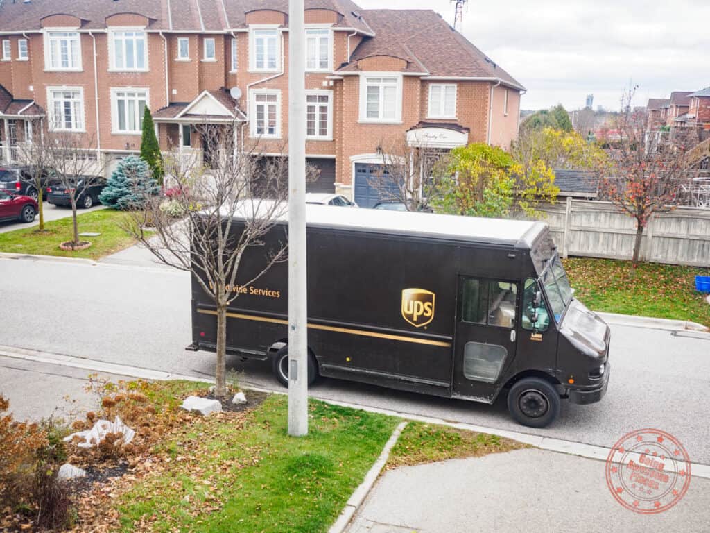 ups delivery truck in local neighborhood