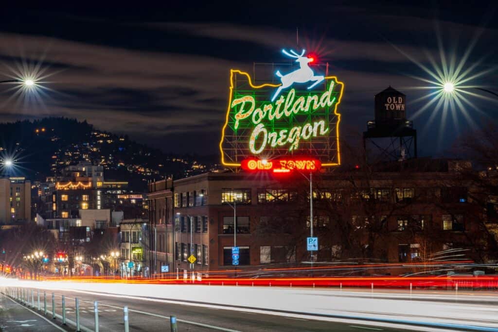Portland Oregon neon sign at night driving into city